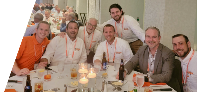 Knox team members posing for group photo at a dinner